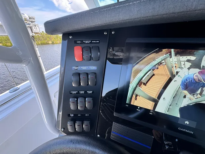  Yacht Photos Pics 2024 Blackfin 332 CC boat dashboard with control panel and Garmin display screen.