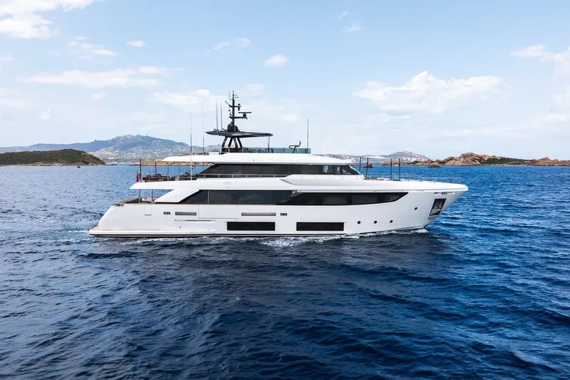 Queen J III Yacht Photos Pics Luxurious 2024 Custom Line Navetta 33 yacht cruising on open sea.