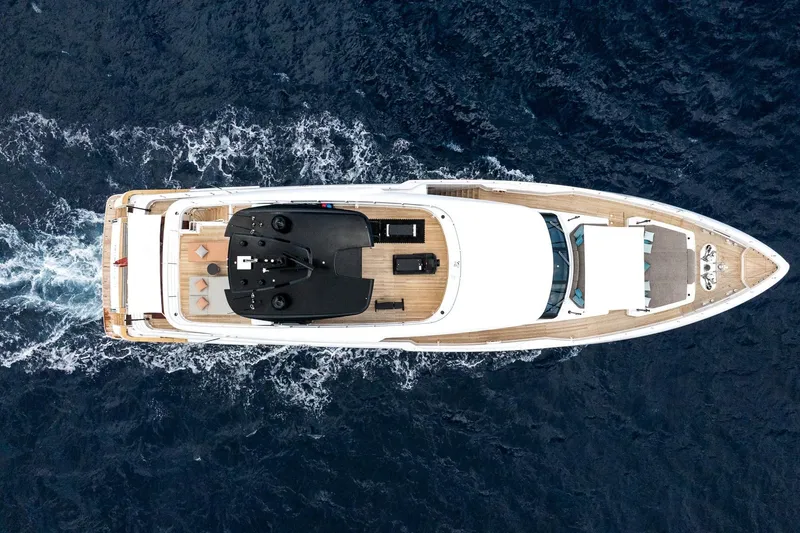 Queen J III Yacht Photos Pics Aerial view of 2024 Custom Line Navetta 33 yacht cruising on the ocean.