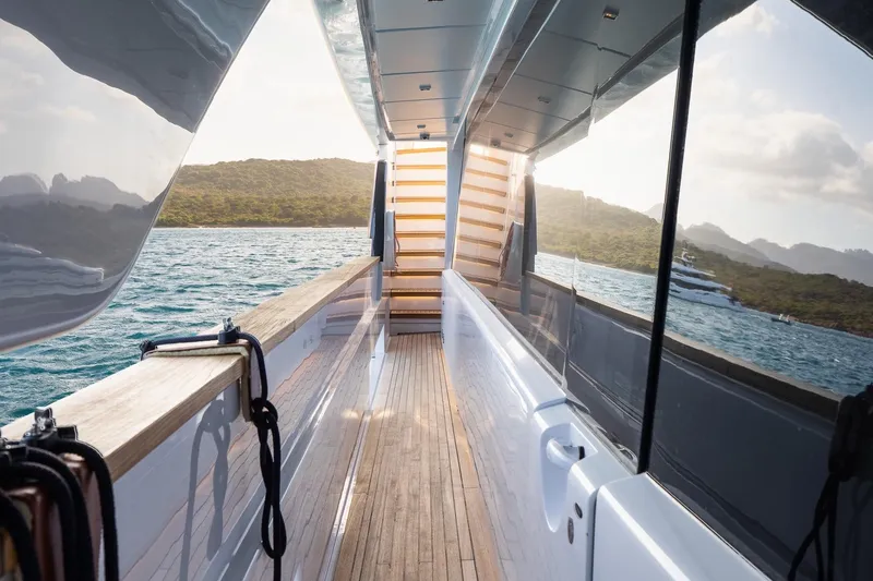 Queen J III Yacht Photos Pics Luxurious 2024 Custom Line Navetta 33 yacht deck with scenic ocean view.