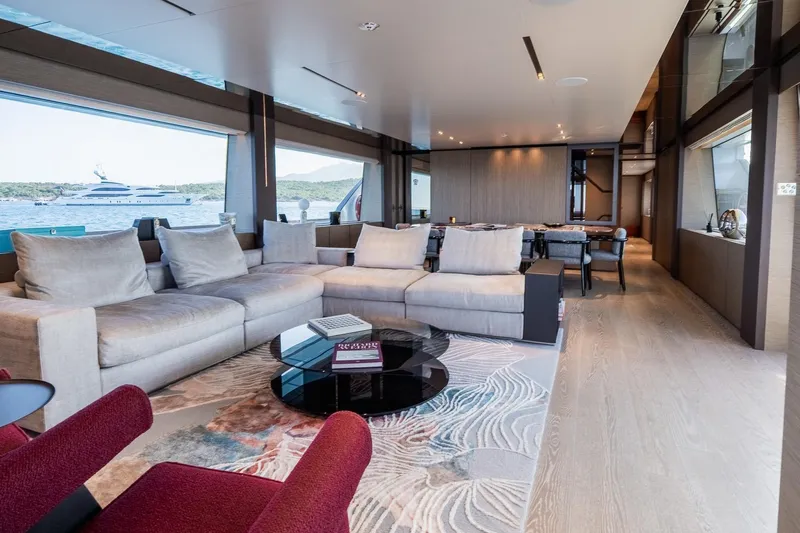 Queen J III Yacht Photos Pics Luxurious interior of 2024 Custom Line Navetta 33 yacht with elegant seating and sea view.