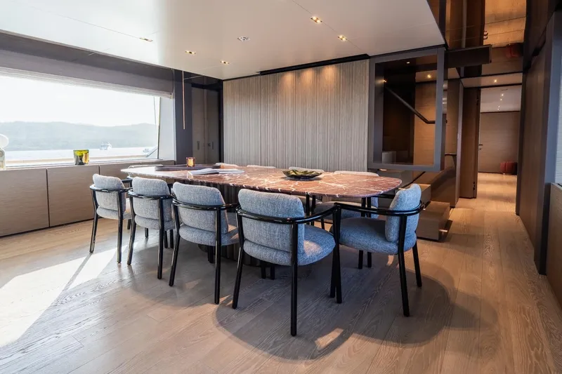 Queen J III Yacht Photos Pics Luxurious dining area on 2024 Custom Line Navetta 33 yacht with elegant furnishings.