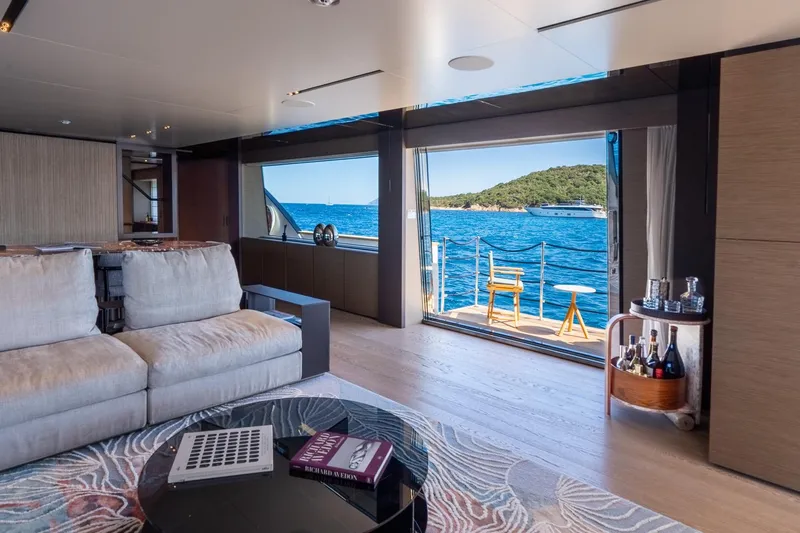 Queen J III Yacht Photos Pics Luxurious interior of 2024 Custom Line Navetta 33 yacht with ocean view and elegant decor.