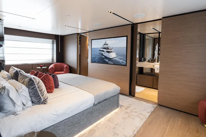 Queen J III Yacht Photos Pics Luxurious bedroom interior on 2024 Custom Line Navetta 33 yacht, featuring modern design and elegant decor.