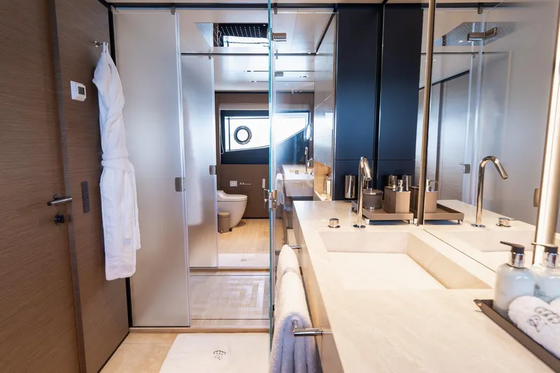 Queen J III Yacht Photos Pics Luxurious bathroom on 2024 Custom Line Navetta 33 yacht, featuring modern fixtures and elegant design.