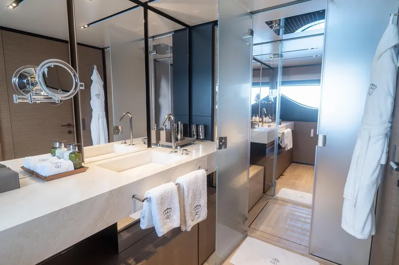 Queen J III Yacht Photos Pics Luxurious bathroom in 2024 Custom Line Navetta 33 yacht, featuring modern fixtures and elegant design.