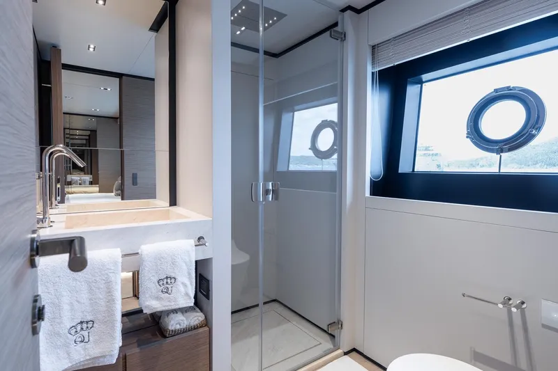 Queen J III Yacht Photos Pics Luxurious bathroom on 2024 Custom Line Navetta 33 yacht with modern fixtures and ocean view.