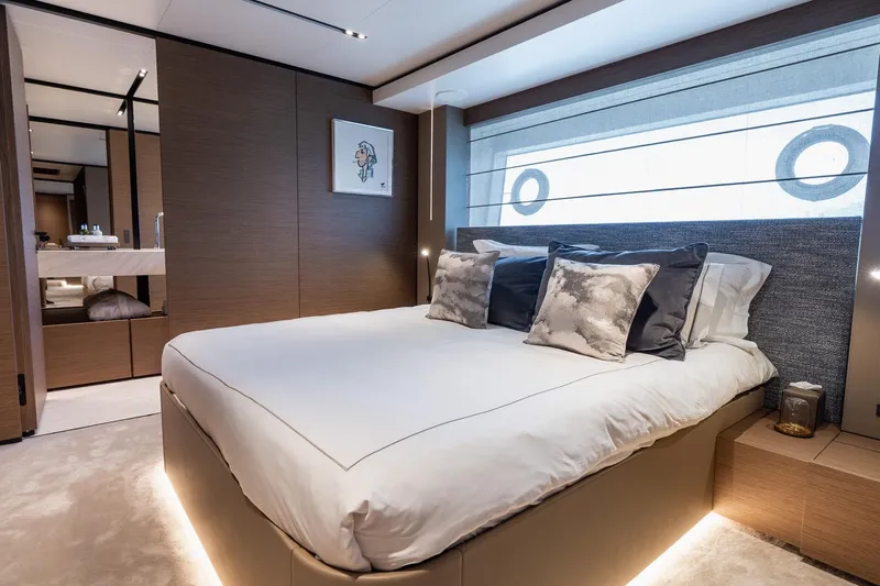 Queen J III Yacht Photos Pics Luxurious bedroom interior on 2024 Custom Line Navetta 33 yacht, featuring elegant design and modern amenities.