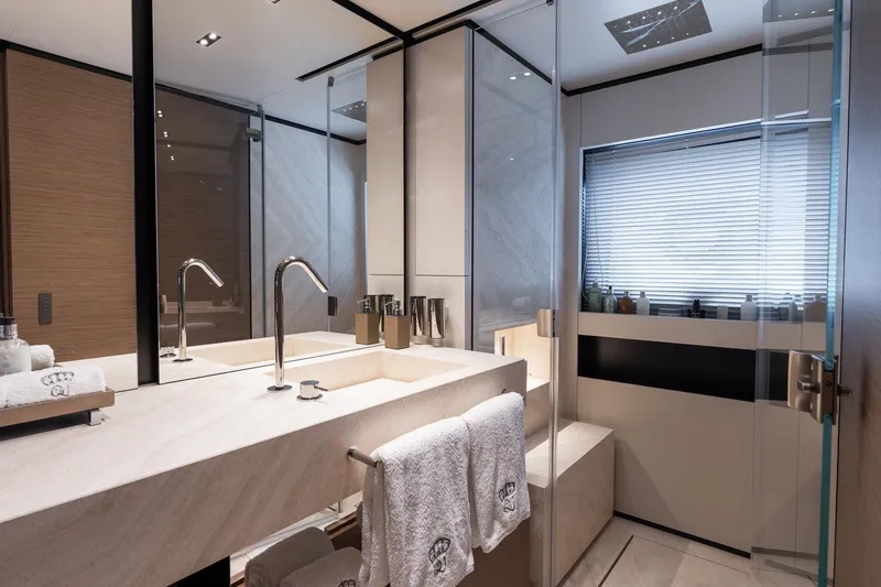 Queen J III Yacht Photos Pics Luxurious bathroom interior on 2024 Custom Line Navetta 33 yacht, featuring modern fixtures and elegant design.