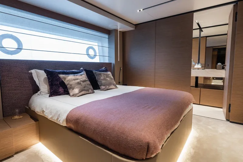 Queen J III Yacht Photos Pics Luxurious bedroom interior on 2024 Custom Line Navetta 33 yacht, featuring elegant design and plush bedding.