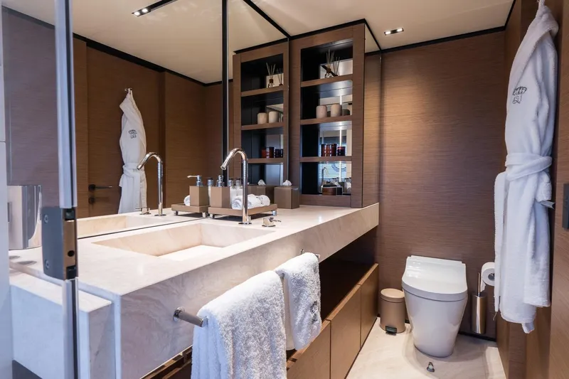 Queen J III Yacht Photos Pics Luxurious bathroom on Custom Line Navetta 33 yacht, featuring elegant fixtures and modern design, 2024 model.