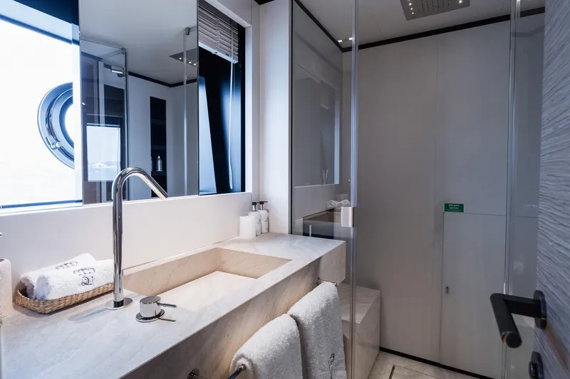 Queen J III Yacht Photos Pics Luxurious bathroom in 2024 Custom Line Navetta 33 yacht with modern fixtures.