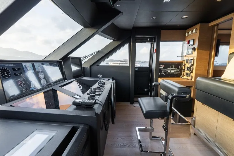 Queen J III Yacht Photos Pics Luxurious 2024 Custom Line Navetta 33 yacht cockpit with modern navigation equipment.