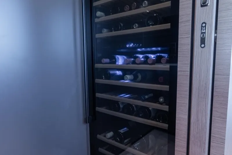 Queen J III Yacht Photos Pics Wine cooler with illuminated shelves on Custom Line Navetta 33 yacht, 2024 model.