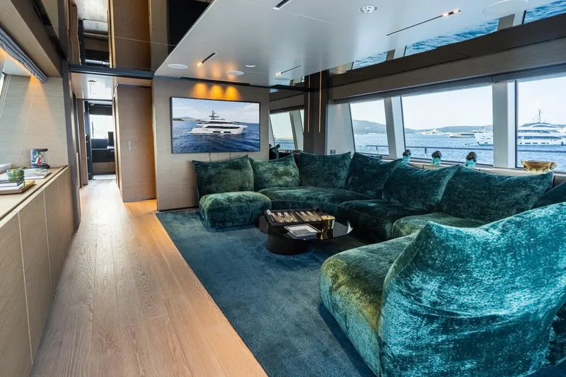 Queen J III Yacht Photos Pics Luxurious interior of 2024 Custom Line Navetta 33 yacht with plush seating and scenic views.