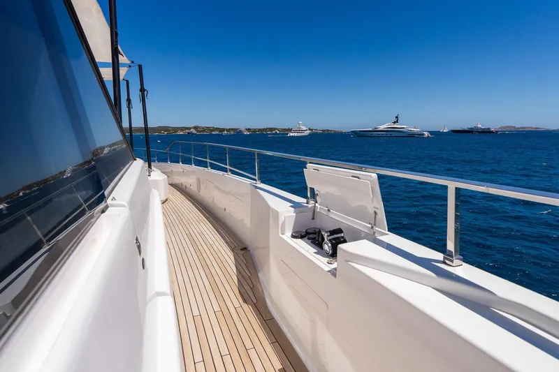 Queen J III Yacht Photos Pics 2024 Custom Line Navetta 33 yacht cruising on a sunny day, with ocean view.