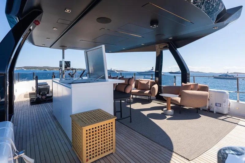 Queen J III Yacht Photos Pics Luxurious 2024 Custom Line Navetta 33 yacht deck with modern seating and ocean view.