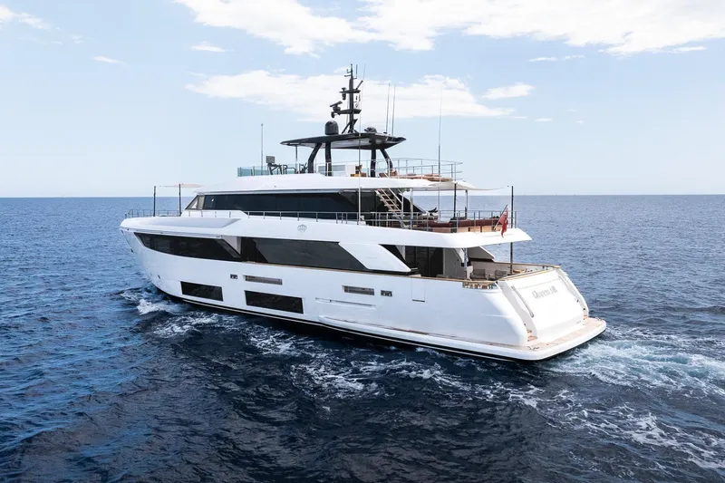 Queen J III Yacht Photos Pics Luxurious 2024 Custom Line Navetta 33 yacht cruising on open sea.