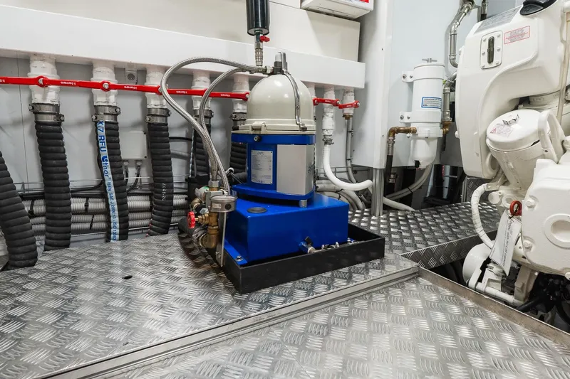 Queen J III Yacht Photos Pics Engine room of 2024 Custom Line Navetta 33 yacht with machinery and piping.