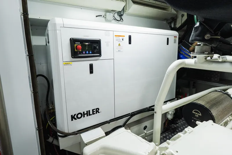 Queen J III Yacht Photos Pics Engine room of 2024 Custom Line Navetta 33 yacht with Kohler generator.
