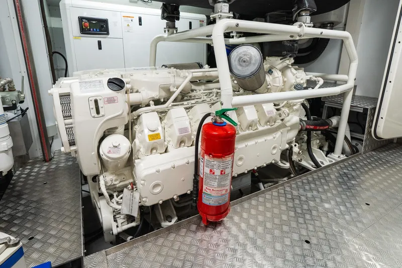 Queen J III Yacht Photos Pics Engine room of 2024 Custom Line Navetta 33 yacht with fire extinguisher.