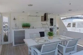 Ms Mickey Yacht Photos Pics 1998 Ocean Alexander Yachtfish Command Bridge with elegant outdoor dining area.