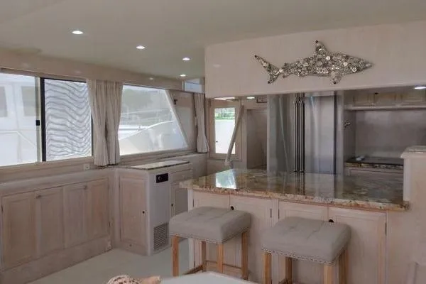 Ms Mickey Yacht Photos Pics Luxurious 1998 Ocean Alexander Yachtfish Command Bridge interior with modern kitchen and elegant decor.