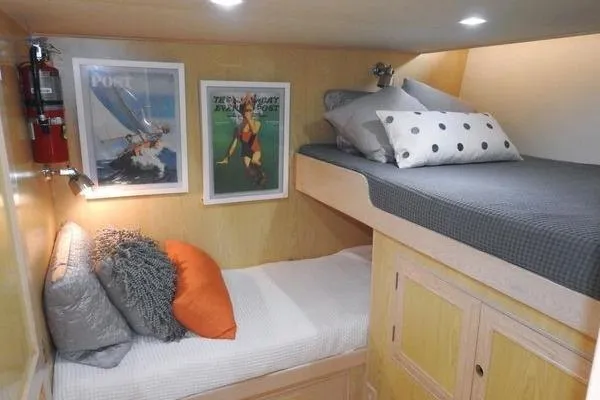 Ms Mickey Yacht Photos Pics Cozy 1998 Ocean Alexander Yachtfish Command Bridge cabin with bunk beds and nautical decor.
