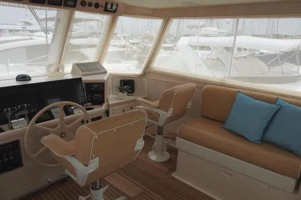 Ms Mickey Yacht Photos Pics 1998 Ocean Alexander Yachtfish Command Bridge interior with helm, seating, and marina view.