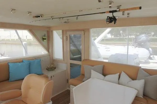 Ms Mickey Yacht Photos Pics Interior of 1998 Ocean Alexander Yachtfish Command Bridge with seating and fishing rod.