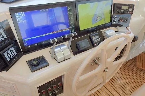 Ms Mickey Yacht Photos Pics 1998 Ocean Alexander Yachtfish Command Bridge helm with navigation screens and controls.