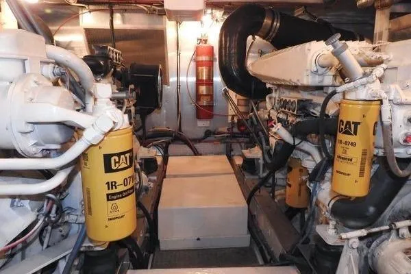 Ms Mickey Yacht Photos Pics Engine room of 1998 Ocean Alexander Yachtfish Command Bridge with CAT filters and fire extinguisher.