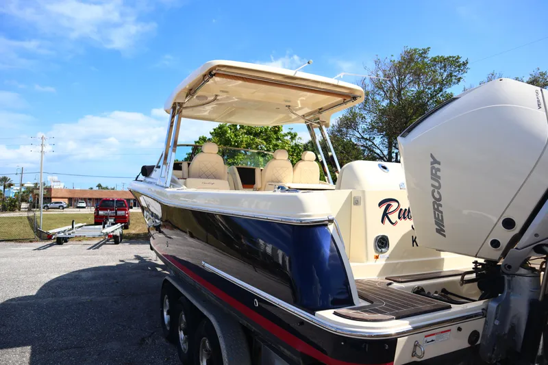  Yacht Photos Pics 2020 Chris-Craft Calypso 30 boat with Mercury engine, parked on a trailer.