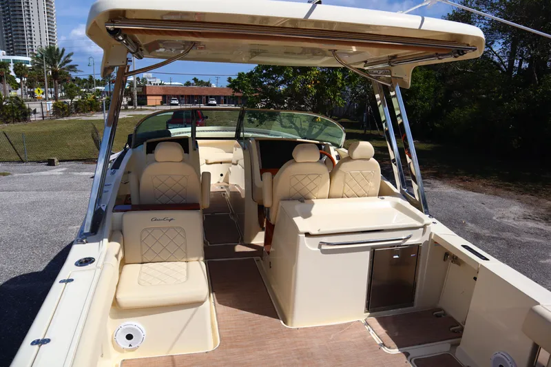  Yacht Photos Pics 2020 Chris-Craft Calypso 30 boat interior with beige seating and modern amenities.