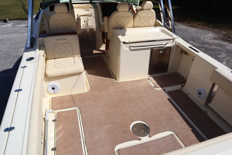  Yacht Photos Pics 2020 Chris-Craft Calypso 30 boat interior with beige seating and spacious deck.