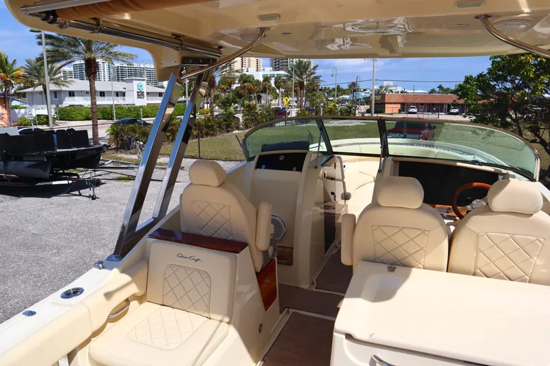  Yacht Photos Pics 2020 Chris-Craft Calypso 30 boat interior with luxurious seating and helm.