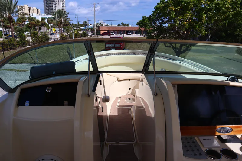  Yacht Photos Pics 2020 Chris-Craft Calypso 30 boat interior with dashboard and windshield view.