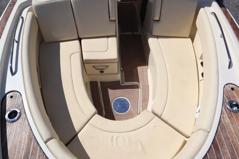 Yacht Photos Pics 2020 Chris-Craft Calypso 30 boat interior with beige seating and wood flooring.