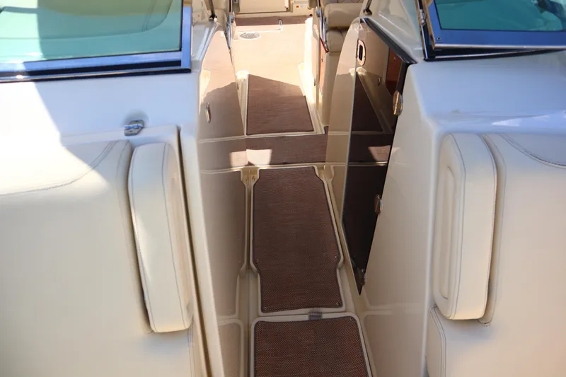  Yacht Photos Pics 2020 Chris-Craft Calypso 30 interior with beige seating and brown flooring.