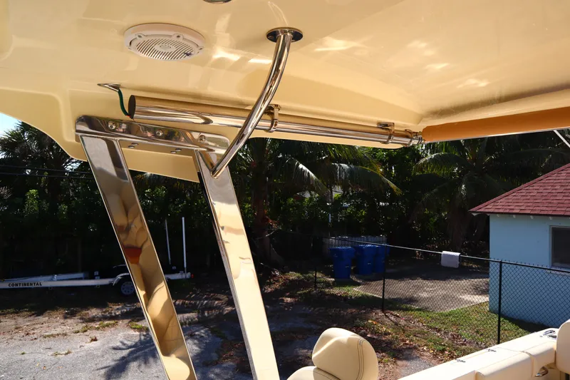  Yacht Photos Pics 2020 Chris-Craft Calypso 30 boat interior with polished metal accents and seating.