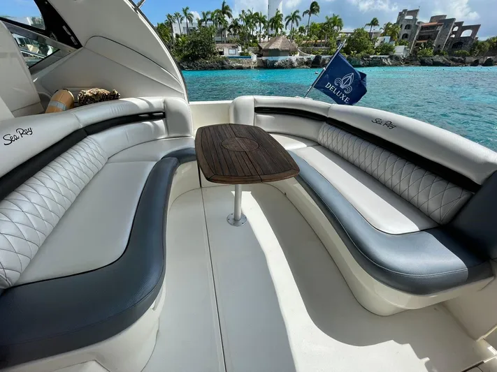  Yacht Photos Pics 2006 Sea Ray Sundancer boat interior with seating and table, ocean view.