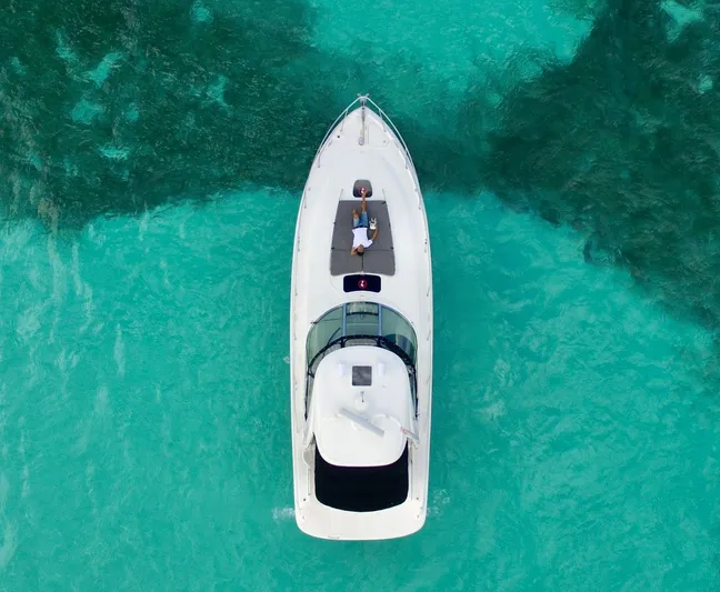  Yacht Photos Pics Top view of a 2006 Sea Ray Sundancer yacht on clear turquoise water.