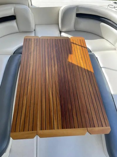 Yacht Photos Pics Teak table on 2006 Sea Ray Sundancer boat with white leather seating.