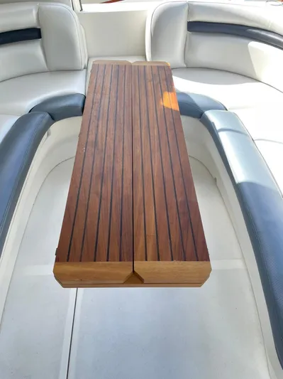  Yacht Photos Pics Interior seating and wooden table on a 2006 Sea Ray Sundancer boat.