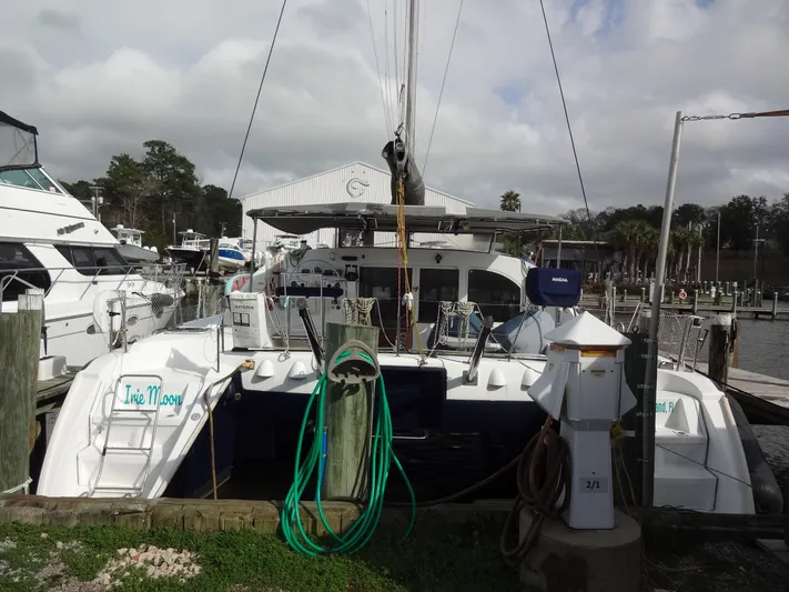 Cajun Moon Yacht Photos Pics 2003 Lagoon 410 catamaran docked at marina.