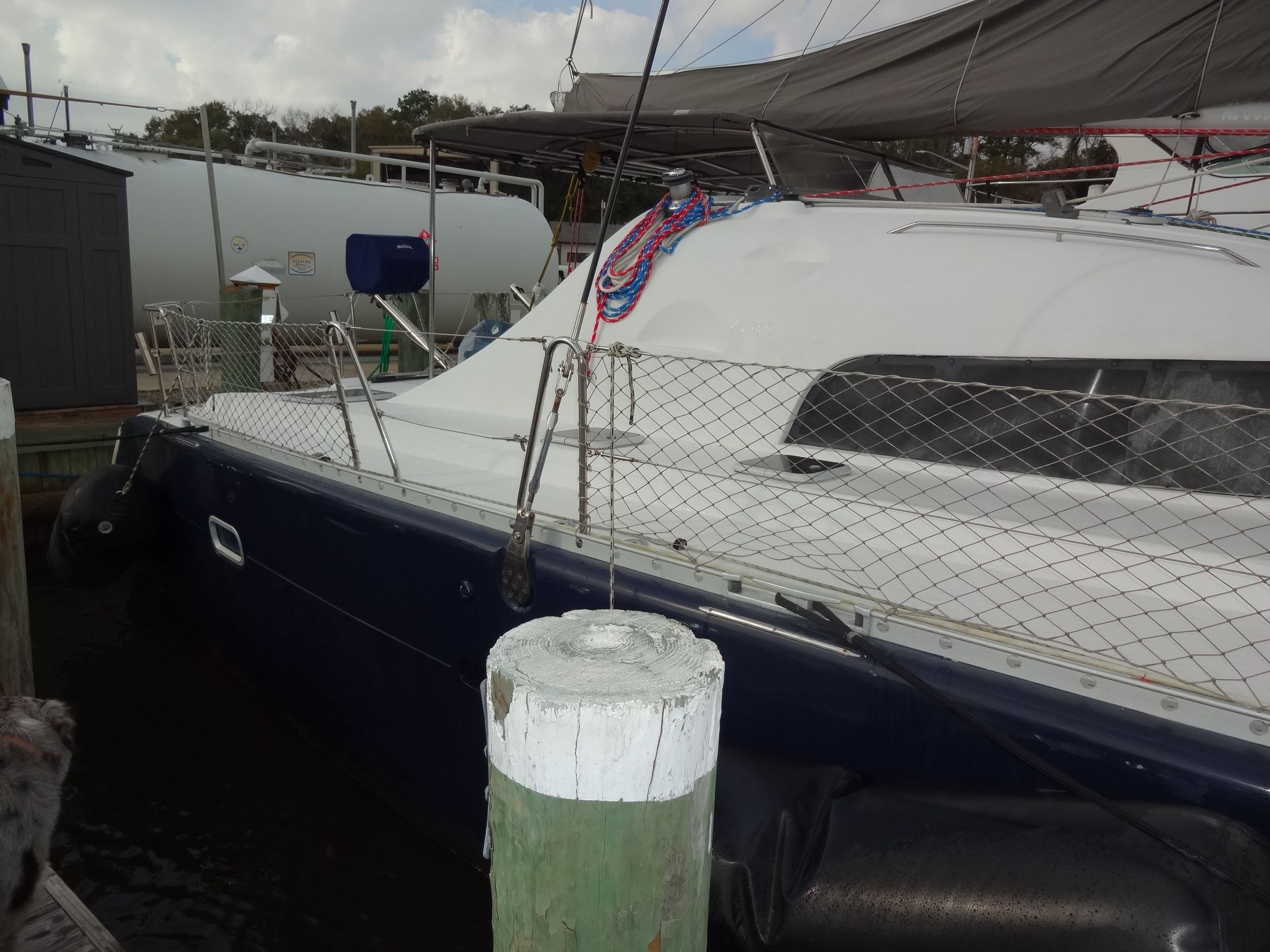 2003 Lagoon 410 catamaran docked at harbor.