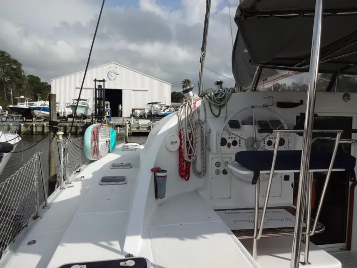 Cajun Moon Yacht Photos Pics 2003 Lagoon 410 catamaran docked with steering wheel view.