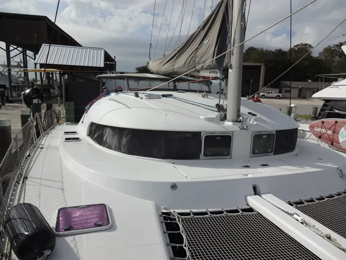 Cajun Moon Yacht Photos Pics 2003 Lagoon 410 catamaran docked at harbor.
