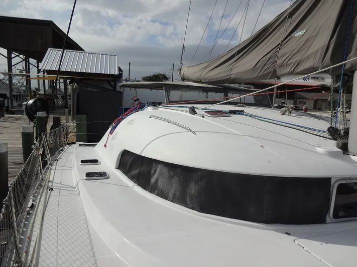 Cajun Moon Yacht Photos Pics 2003 Lagoon 410 catamaran docked at harbor.