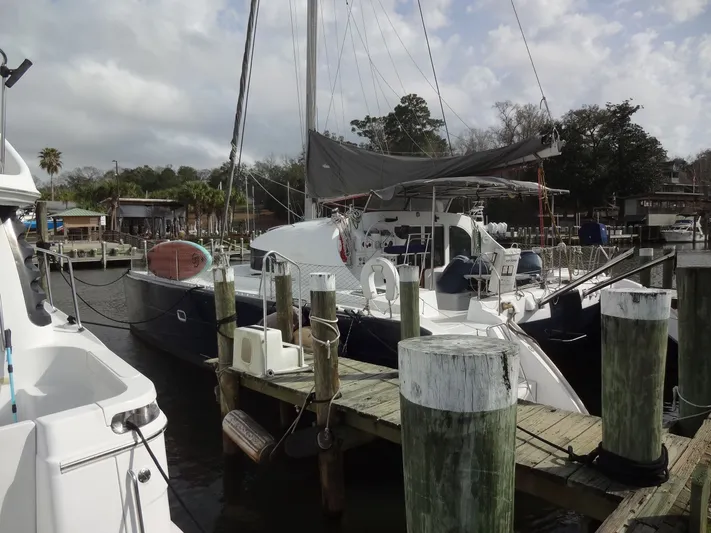 Cajun Moon Yacht Photos Pics 2003 Lagoon 410 catamaran docked on a sunny day.